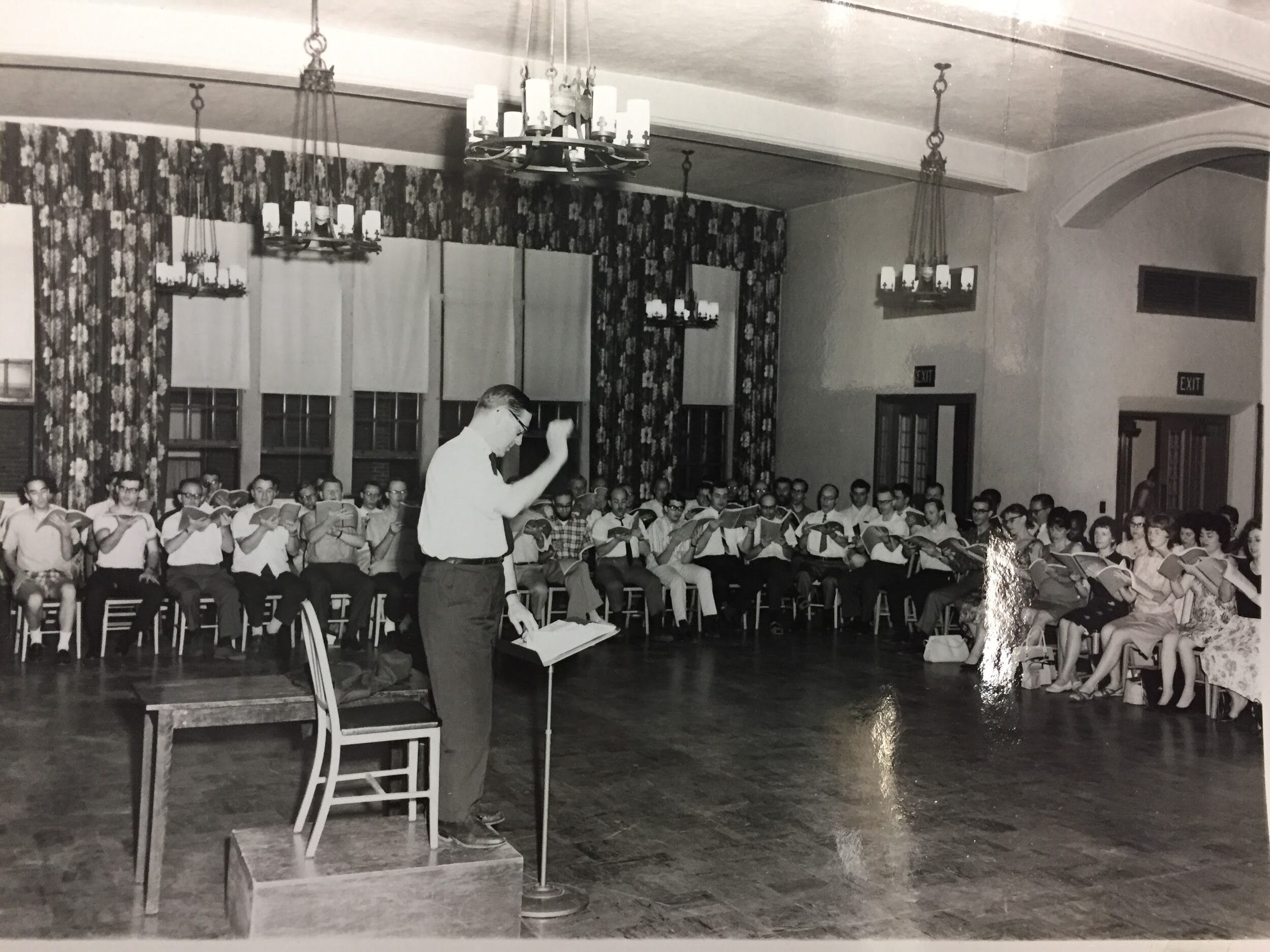 Bud Patterson conducting Chorus pro Musica in Mary Norton Hall